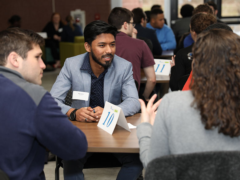 Students networking at career event.