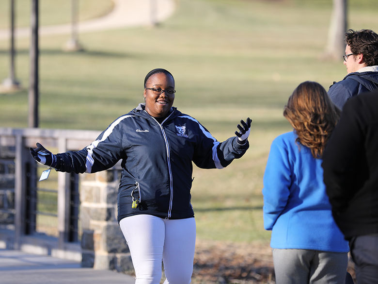 Female student giving campus tour.