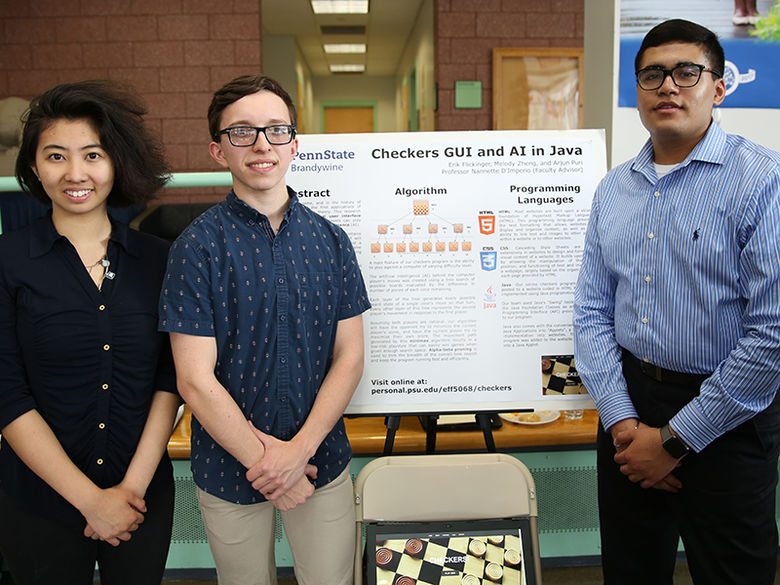 3 students with their research project