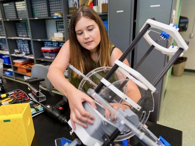 Female engineering student working in lab