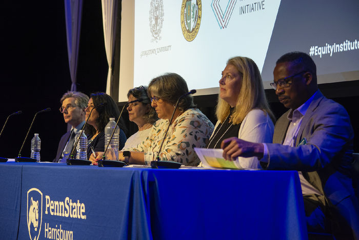 Penn Staters host a workshop panel on a stage at the Penn State Harrisburg campus
