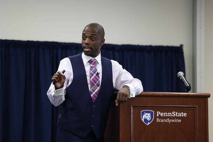 Freddy Shegog speaking at a podium