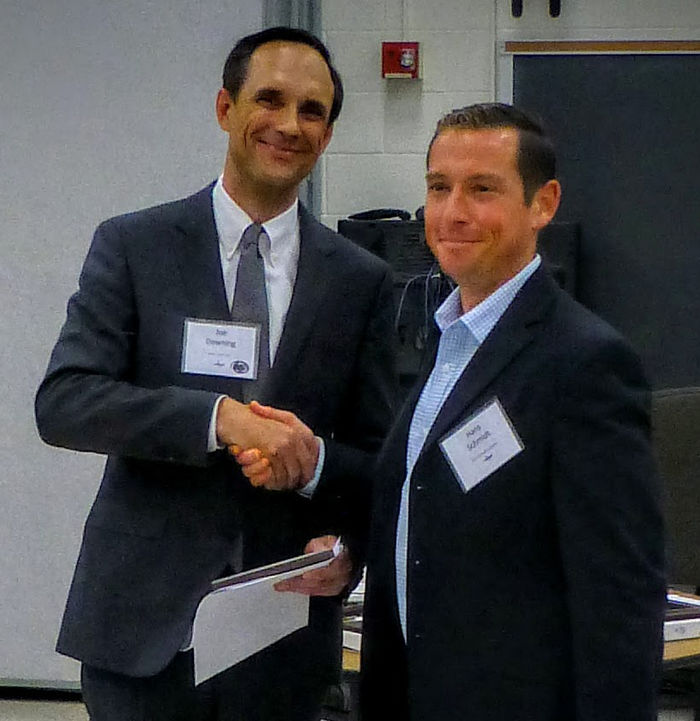 Hans Schmidt shakes hands with Joe Downing