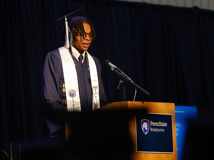A student speaks at commencement.