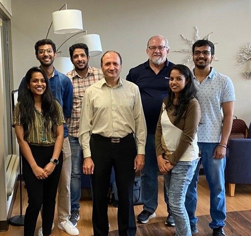 A group of people smiling