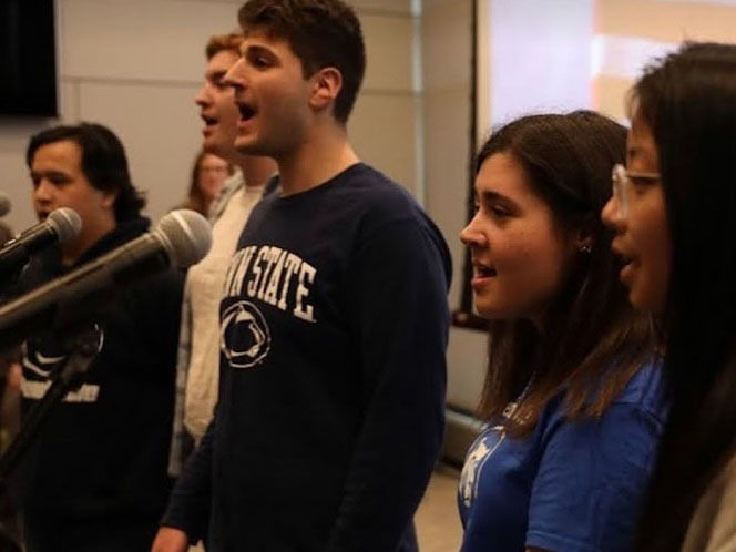Students singing with microphones