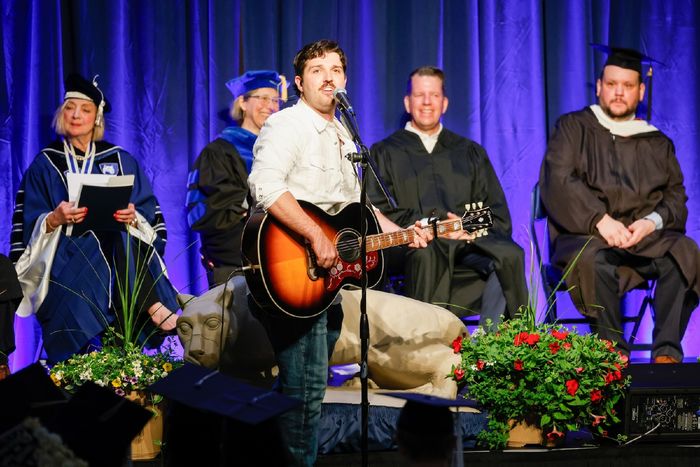 Michael DeGirolamo singing at commencement