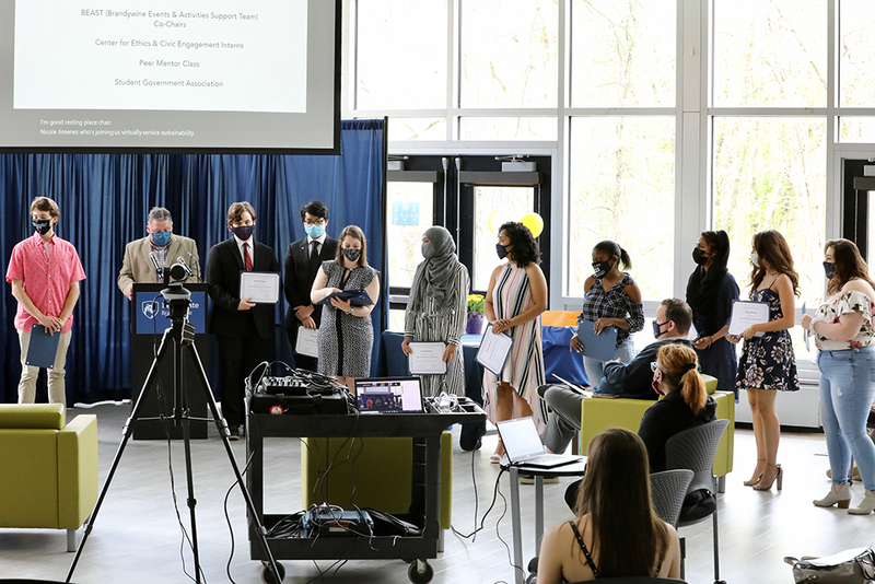 Students receiving their award certificates.