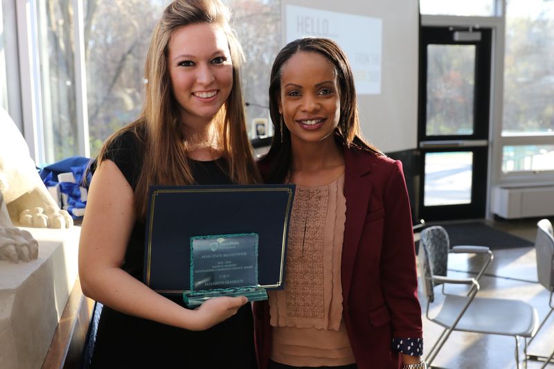 Elisabeth Gramlick and Stephanie Jones pose together with Elisabeth's award