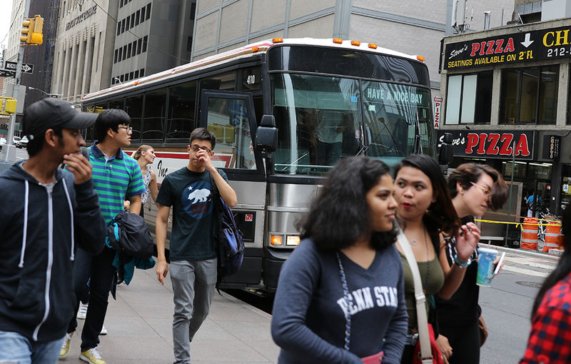 students getting off bus