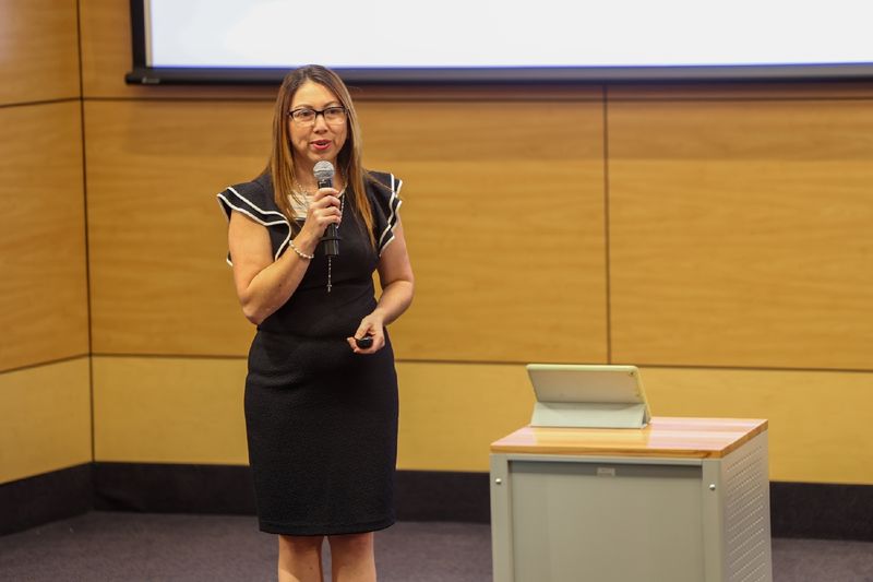 woman speaking into microphone