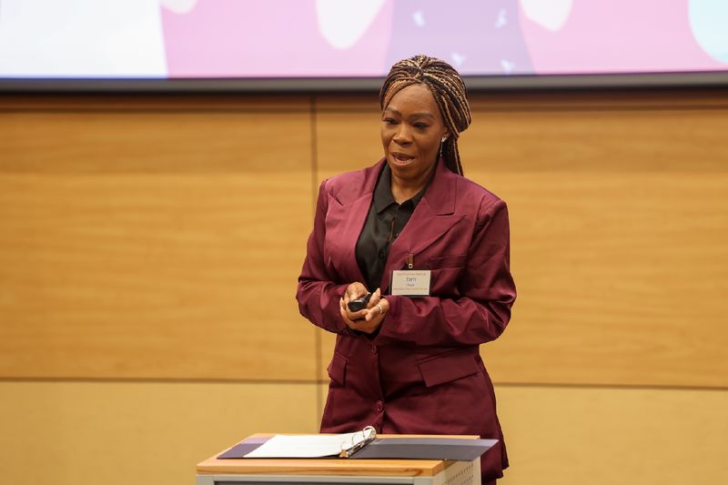 woman speaking at podium