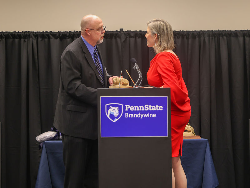 woman receiving award