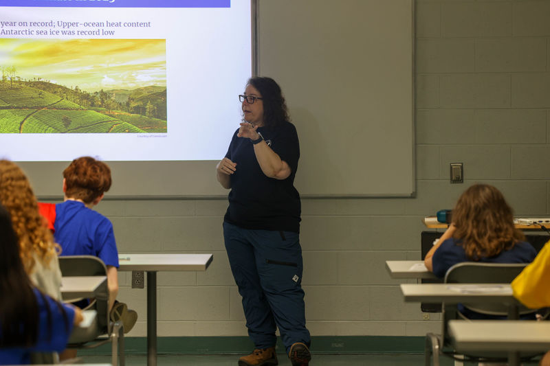 Laura Guertin speaking with students