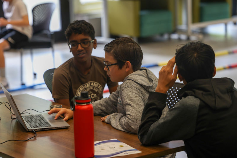 students working on computer