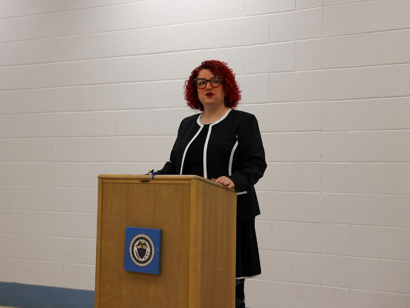 Angela Putman standing at podium
