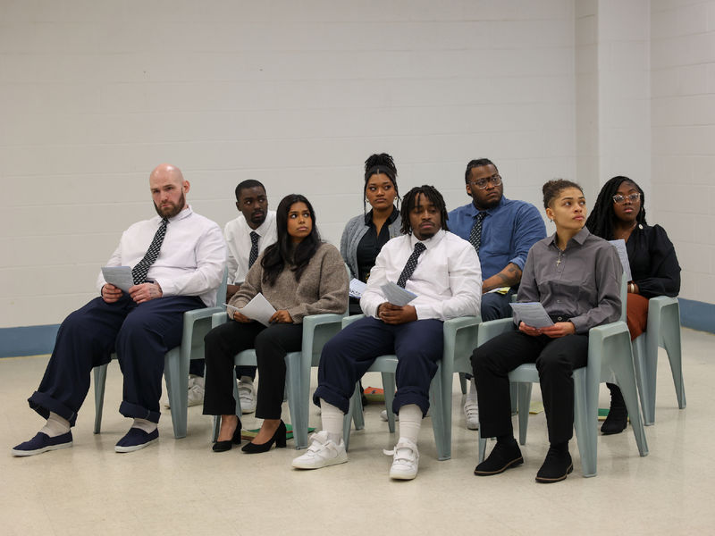 group of students sitting in chairs