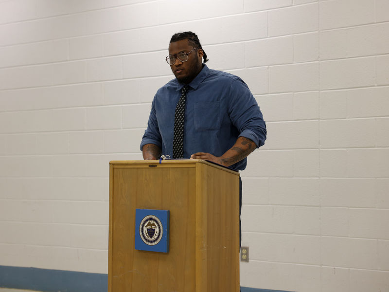 Kevin standing at a podium