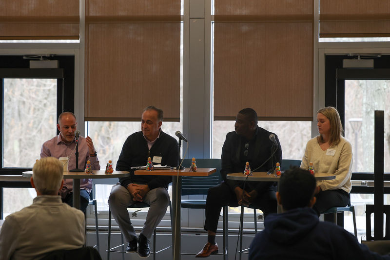 coaches speaking on a panel