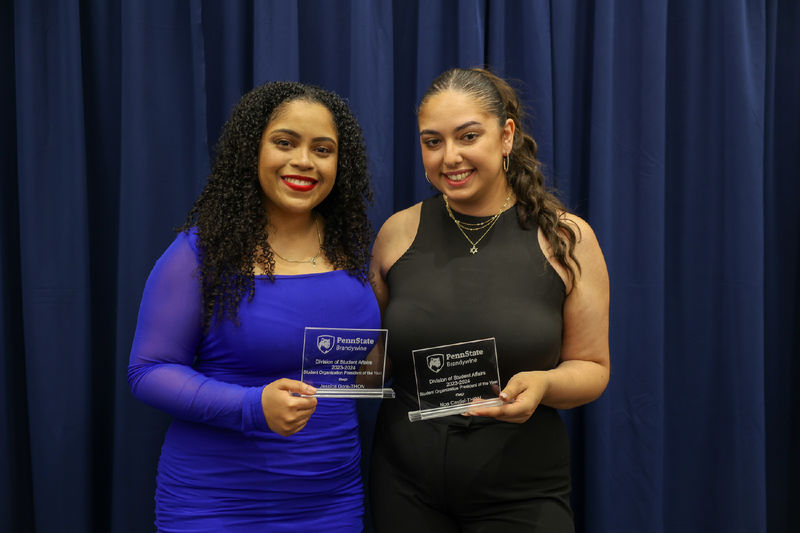 students holding awards