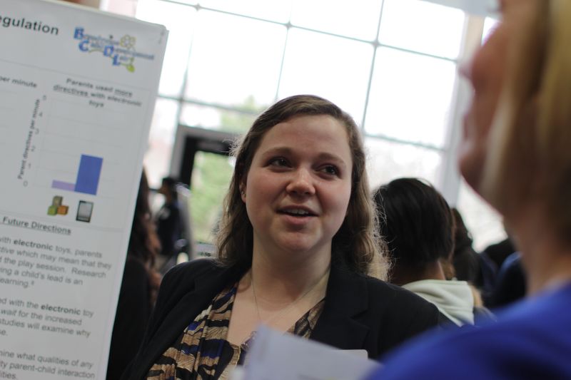 Lauren Lomas with her research poster