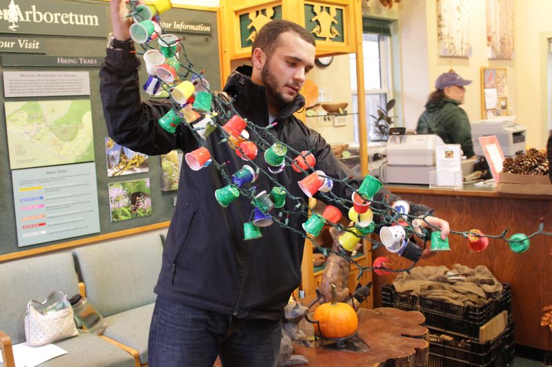 Students holding KCup String of Lights