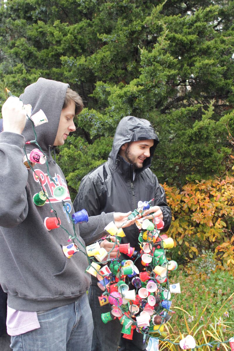 Students Decorate holding strand of KCup Lights