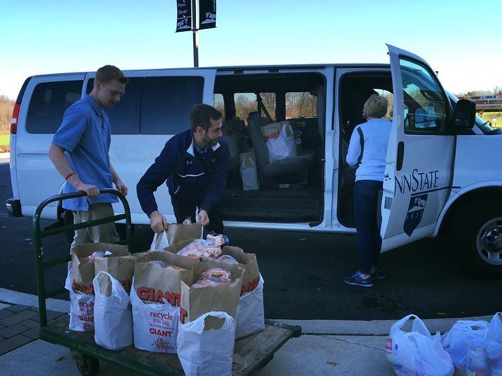 Students loading van with food