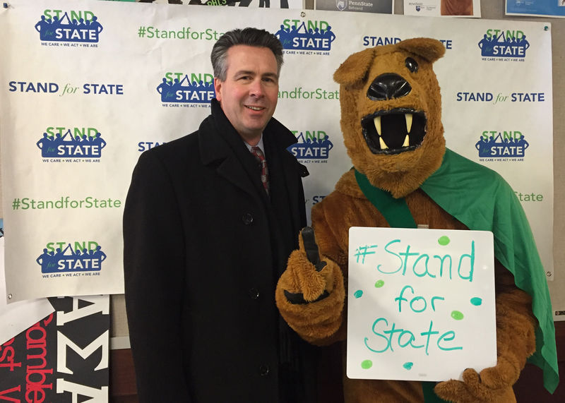 Penn State Behrend Chancellor Ralph Ford and the lion mascot 