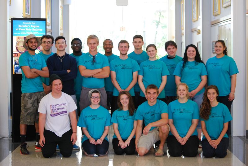 student group poses in PaSSS t-shirts