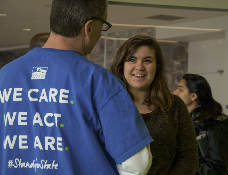 A staff member talking to a student 