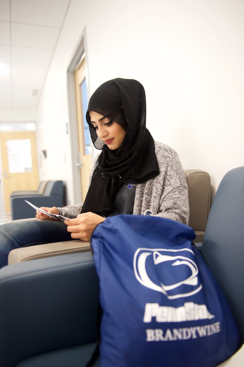 Student reviews her schedule at convocation