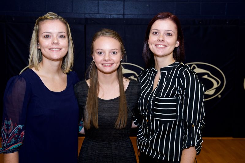 Three sisters pose for photo.