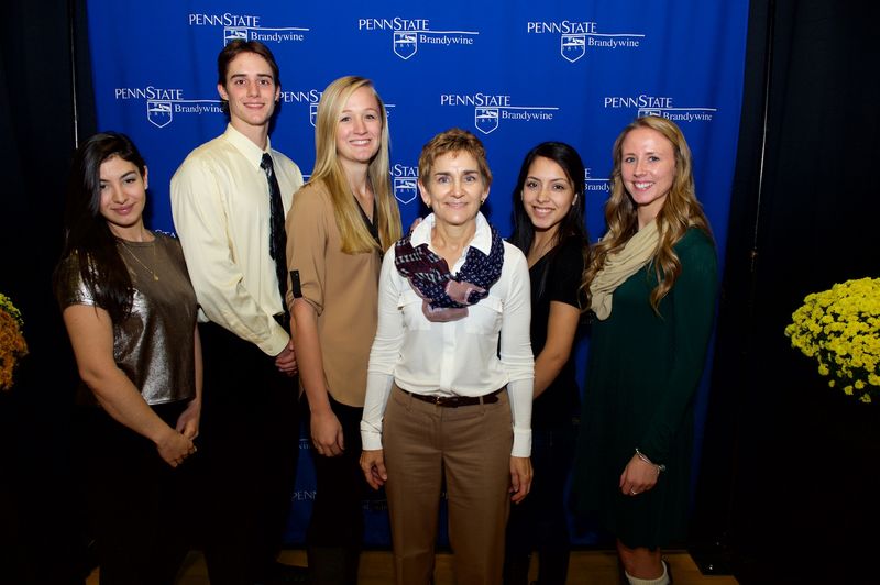 Linker Scholarship recipients and stand with donor
