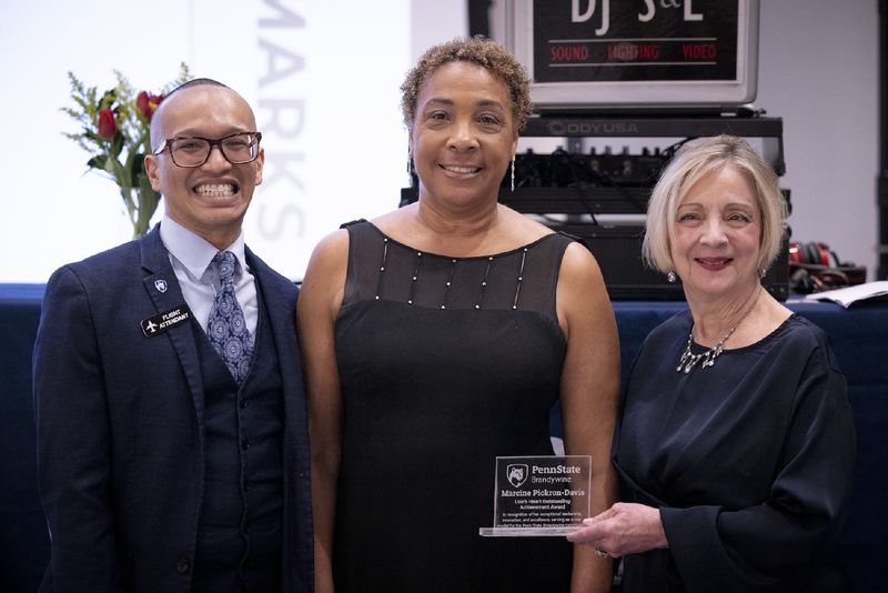 people holding an award