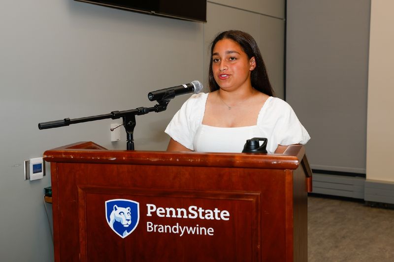 student talking at podium