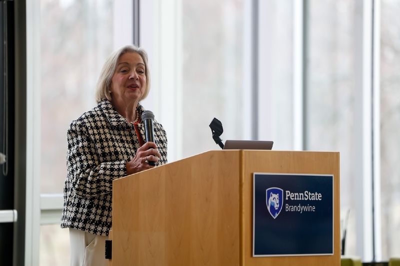 woman speaking at podium