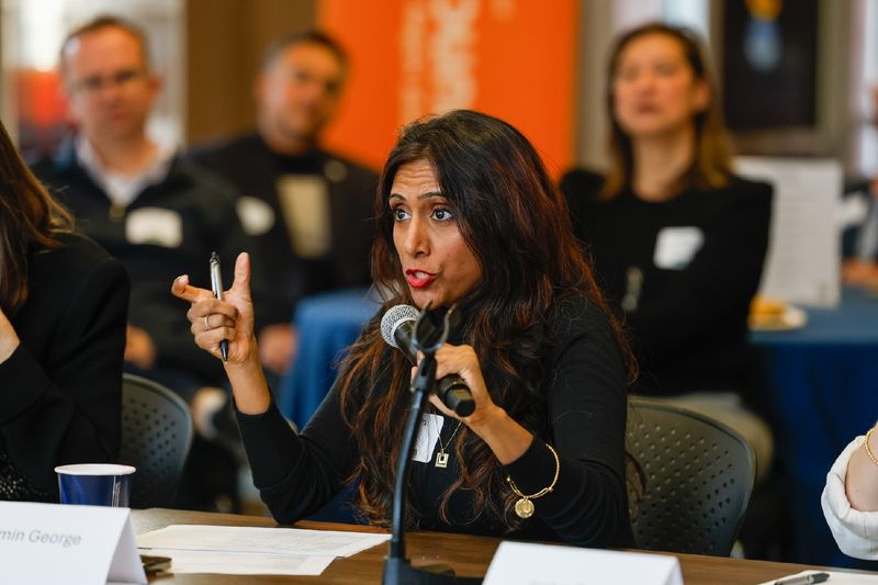 woman speaking into microphone