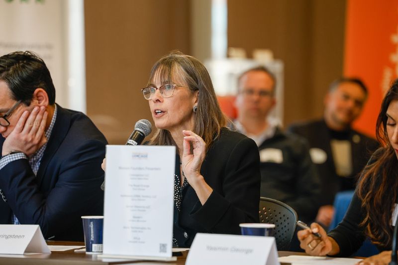 woman speaking into microphone