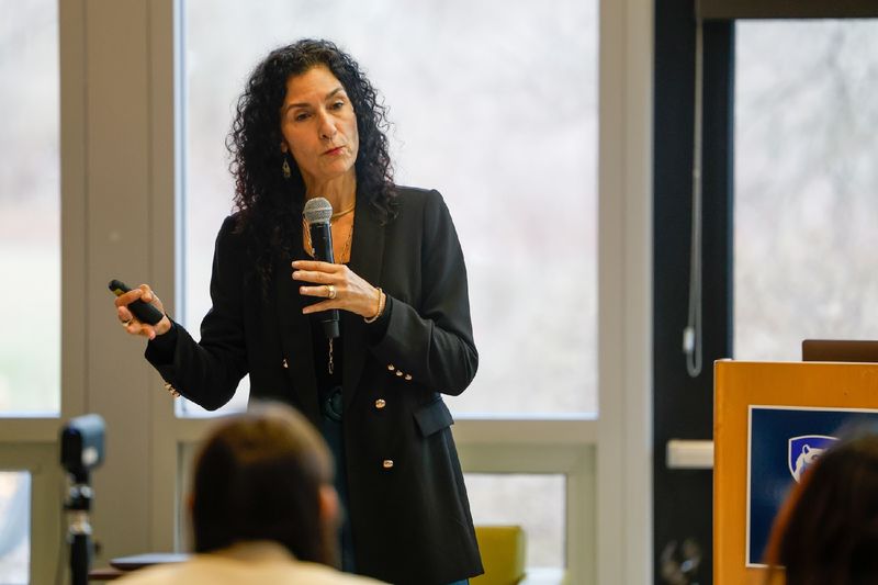 woman speaking into microphone