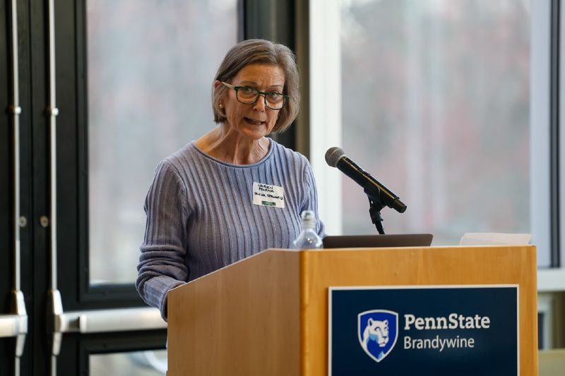 woman speaking at podium