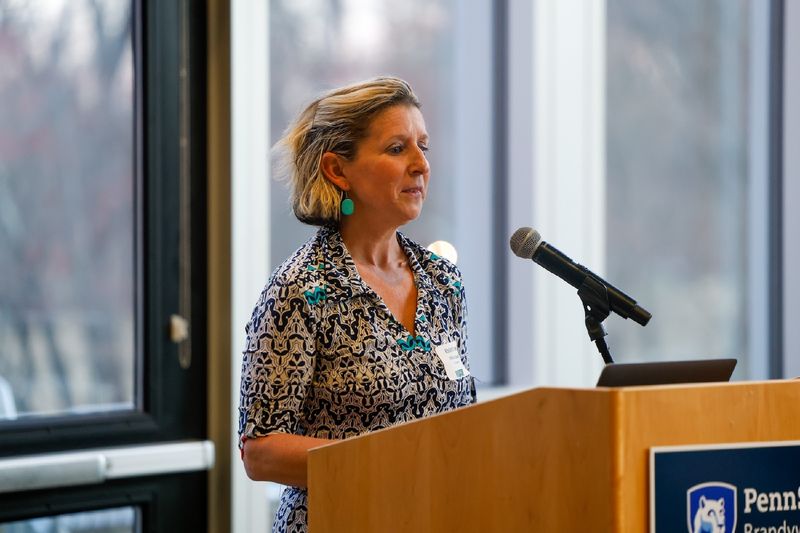 woman speaking at podium