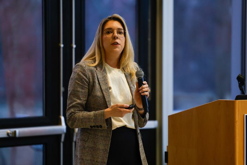 woman speaking into microphone