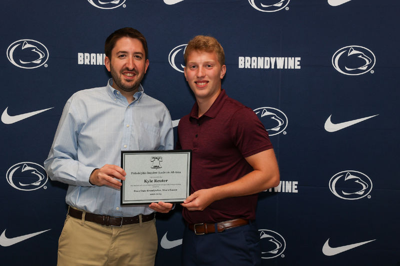 two men holding certificate