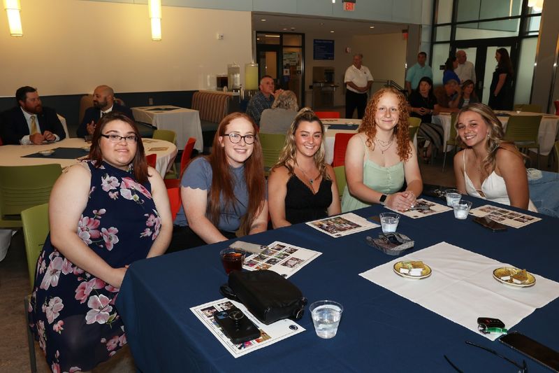 five women sitting at a table