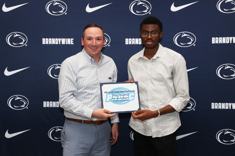 two men holding a certificate