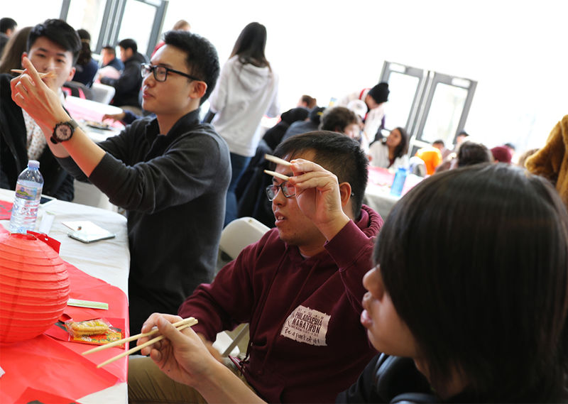 At the event, some students taught everyone how to use chopsticks.