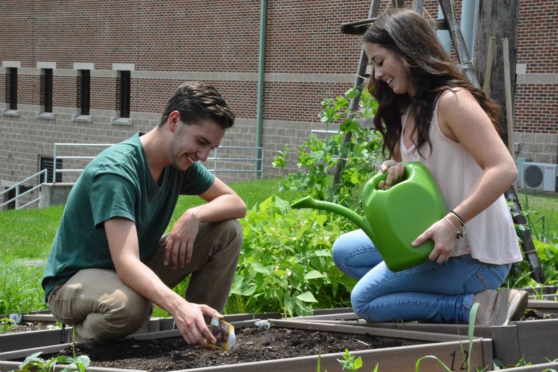 Schuylkill PaSSS students watering a garden as part of a sustainability program