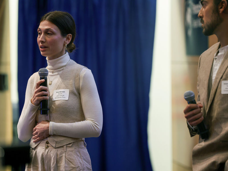 people speaking on a stage