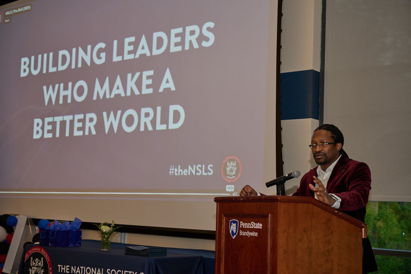 man standing at a podium